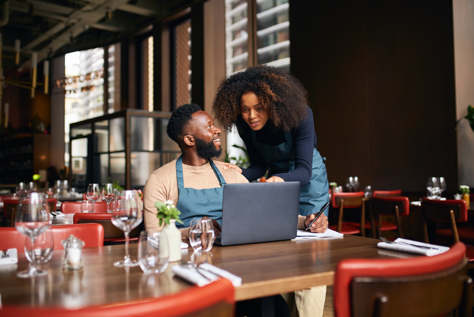 Restaurant Owners Working on Laptop